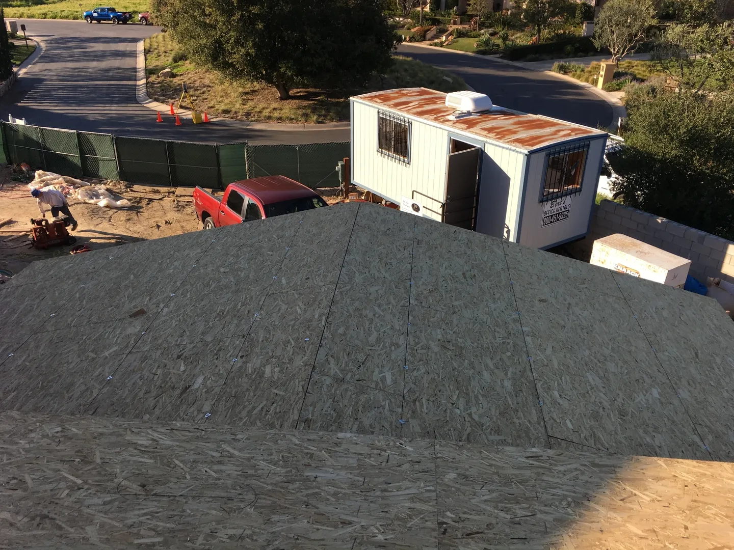 top view of a red car near a cabin