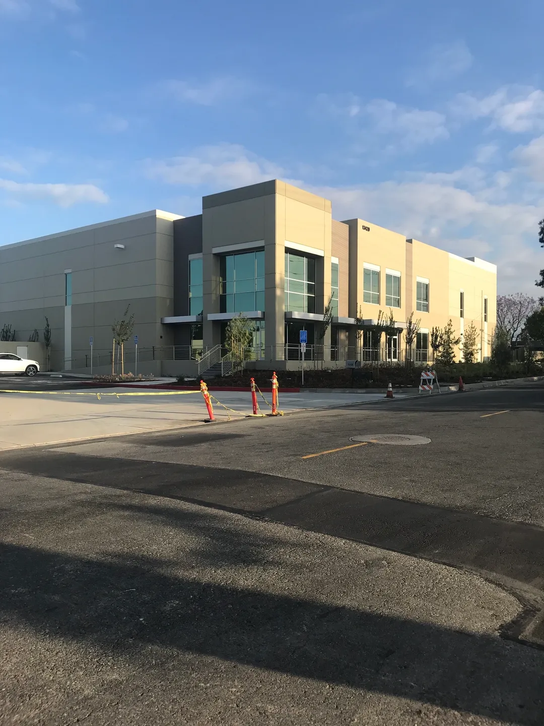 Three road blocks in front of a building