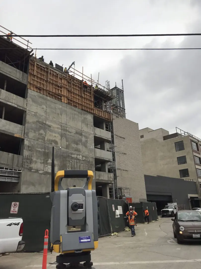 Civil equipment in front of under construction building